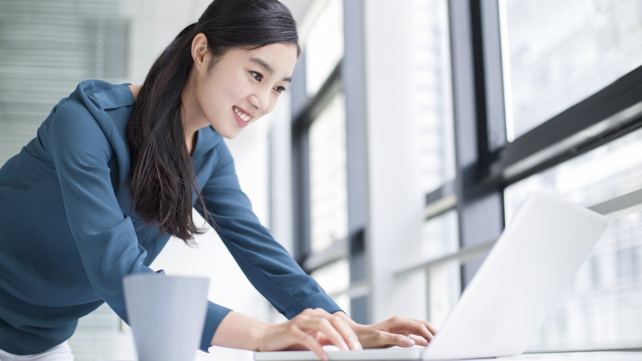 Women happy working using laptop