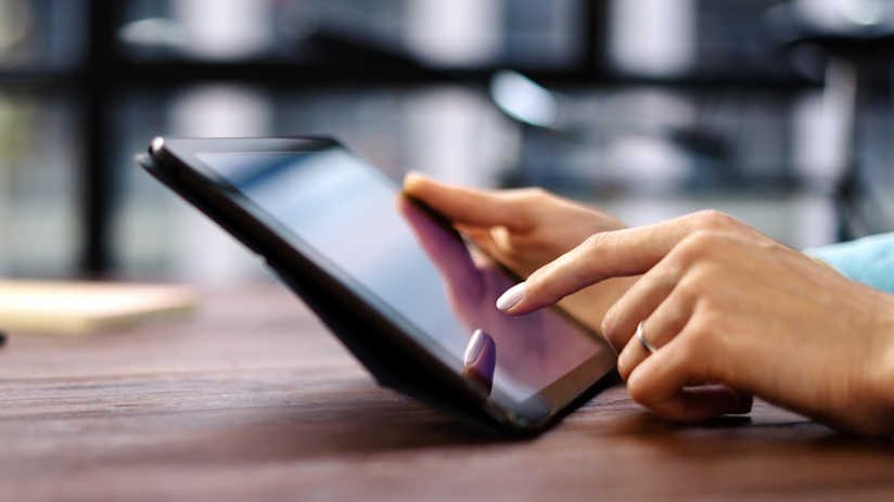 Woman pointing on digital tablet screen